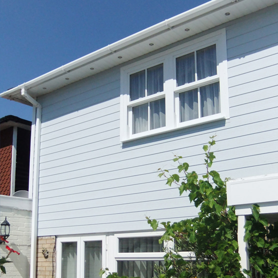 House fitted with external pvc wood effect textured cladding